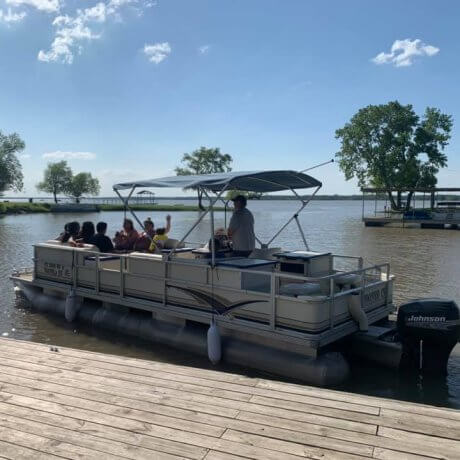 A family laughing together as they enjoy the family-friendly activities at 429 Resort & Marina in Quinlan, TX.