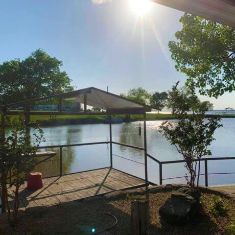 A tranquil view over the marina, featuring docked boats and the glowing lake waters—capturing the serene beauty of Lake Tawakoni at 429 Resort & Marina in Quinlan, TX.