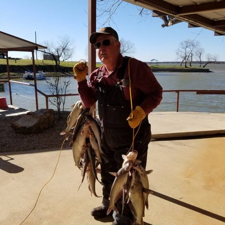 Fishing on the calm waters of Lake Tawakoni, illustrating the outdoor adventure right outside your door at 429 Resort & Marina in Quinlan, TX.