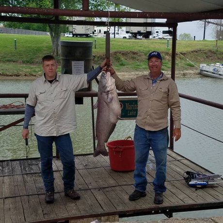 Fishing on the calm waters of Lake Tawakoni, illustrating the outdoor adventure right outside your door at 429 Resort & Marina in Quinlan, TX.