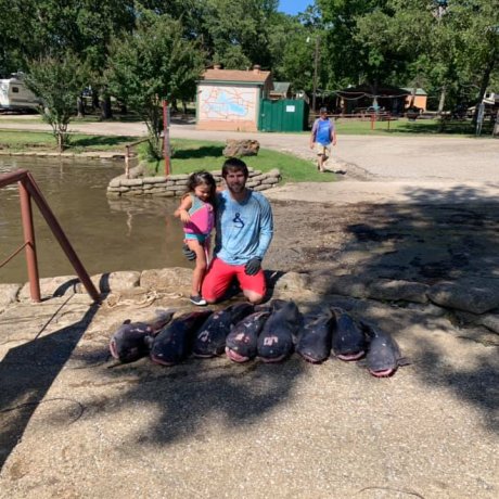 Fishing on the calm waters of Lake Tawakoni, illustrating the outdoor adventure right outside your door at 429 Resort & Marina in Quinlan, TX.