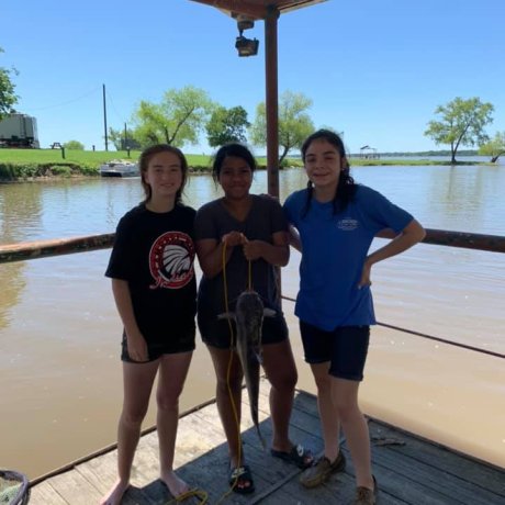 Fishing on the calm waters of Lake Tawakoni, illustrating the outdoor adventure right outside your door at 429 Resort & Marina in Quinlan, TX.